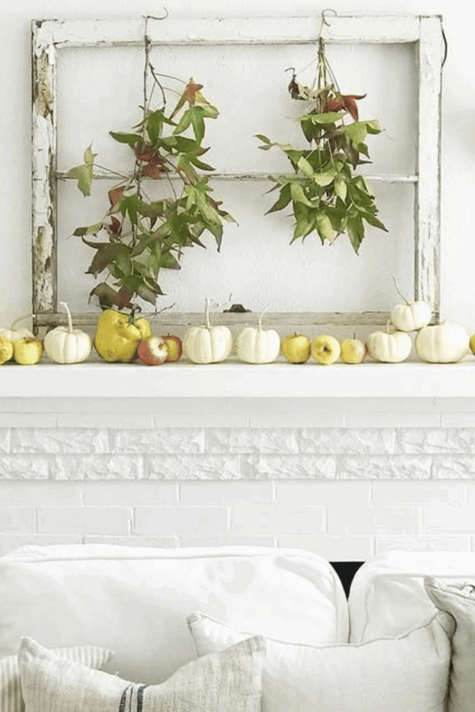 Apple orchard inspired mantel decor with baskets of apples