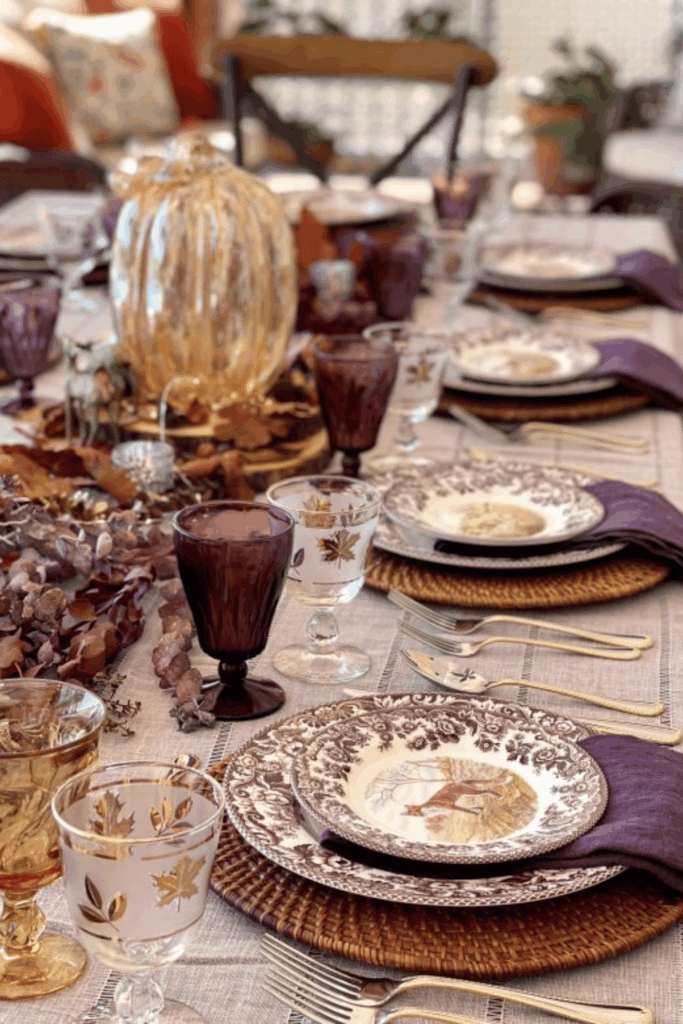 Vintage plates layered for nostalgic fall table decor