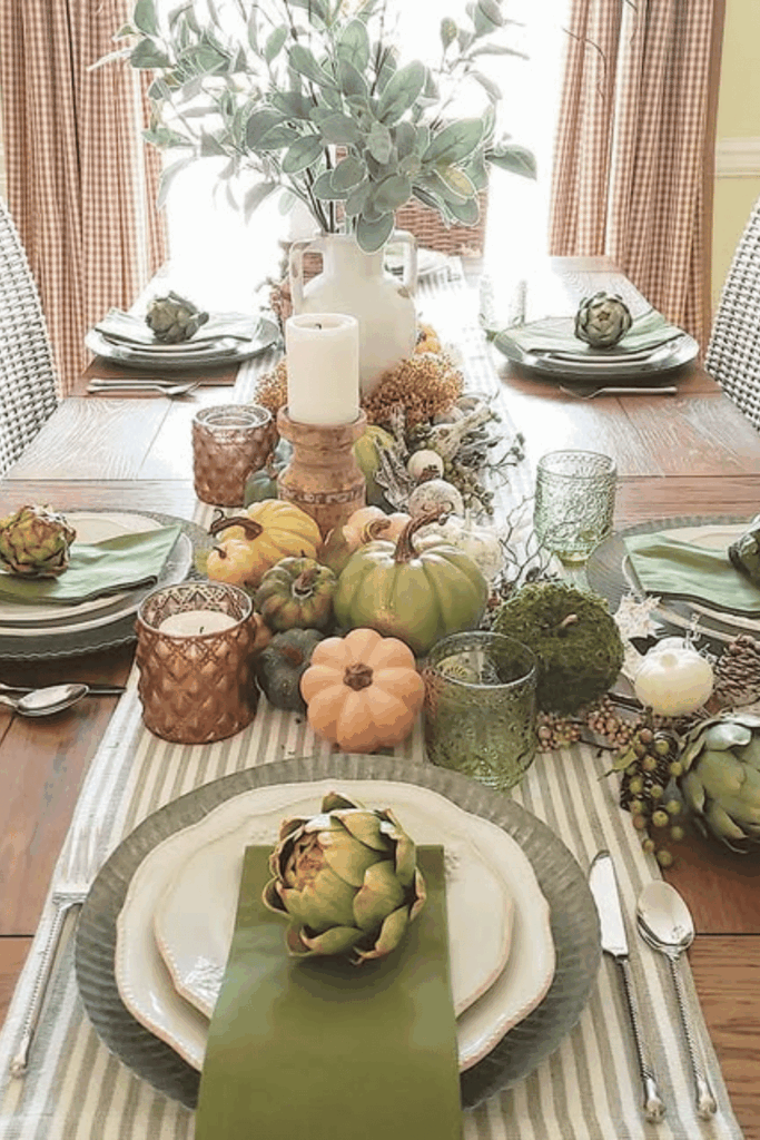 Rustic fall table with fresh greenery and mini pumpkins