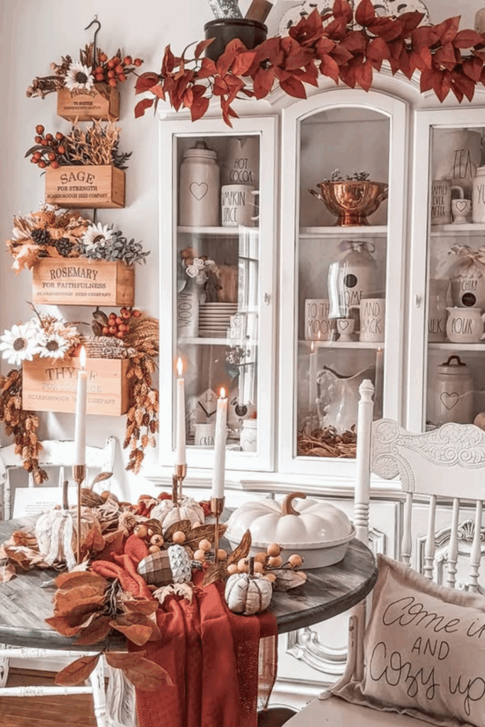 Dining room table with rustic red linens and seasonal accents