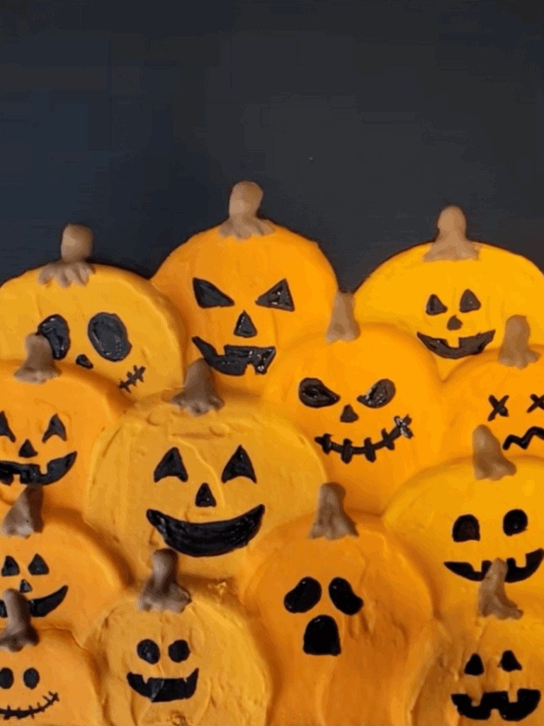 Playful pumpkin patch Halloween painting with smiling jack-o’-lanterns