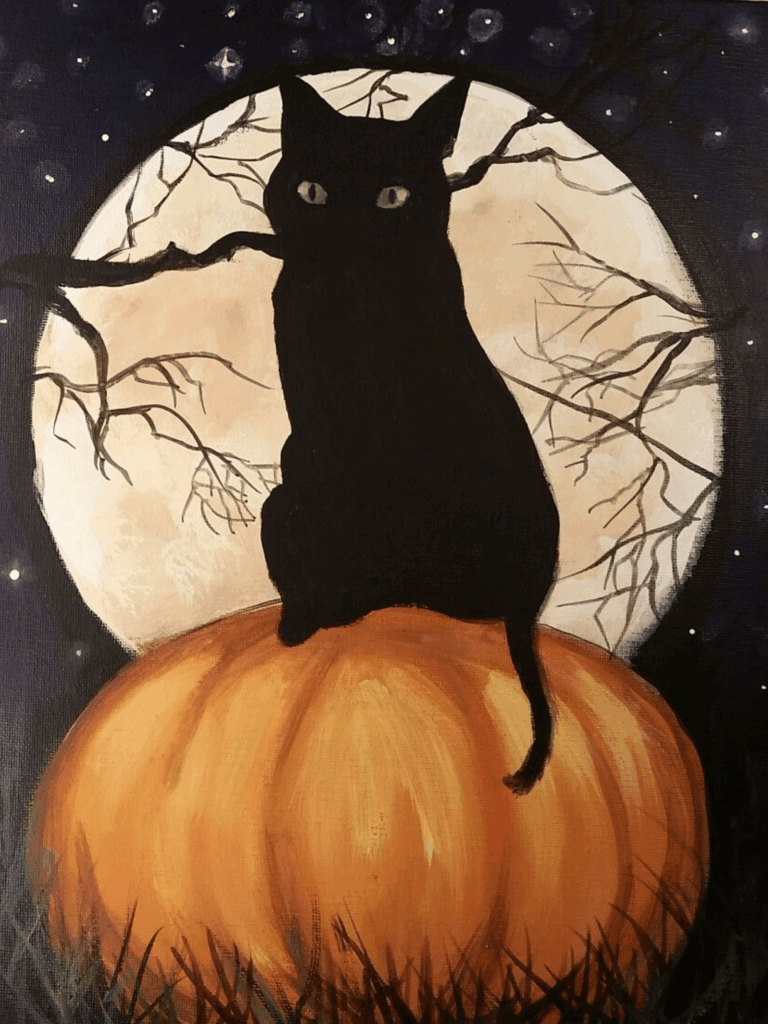 Black cat sitting on pumpkin in front of full moon