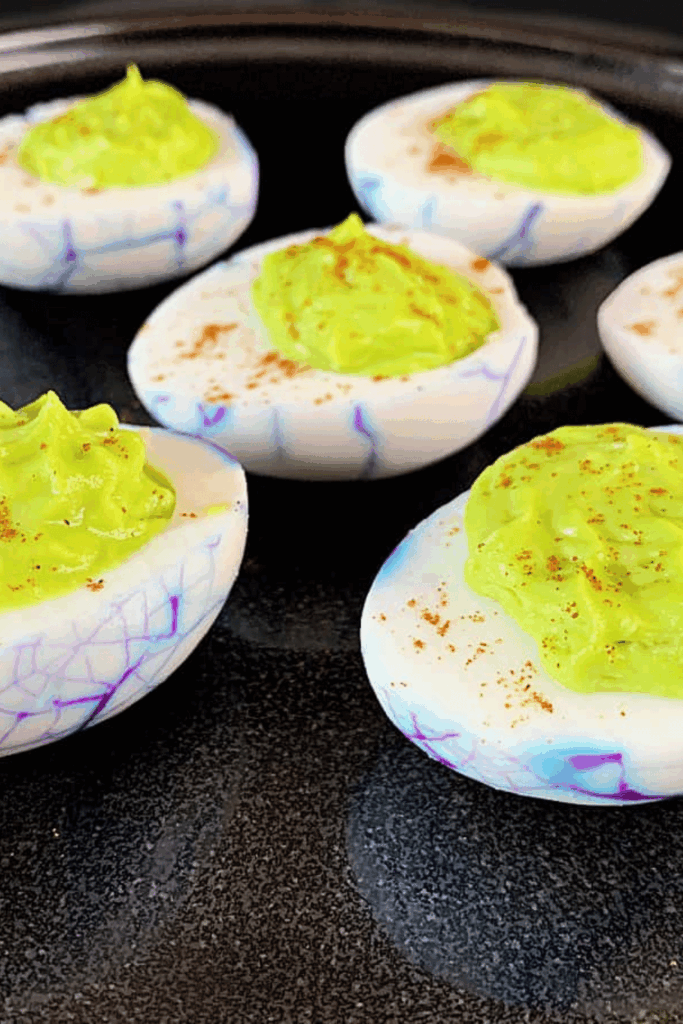 Deviled eggs decorated as bloodshot eyes with red food coloring – best Halloween appetizer recipes