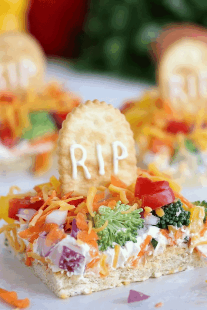 Veggie pizza graveyard with cracker tombstones – fun fall appetizers for parties