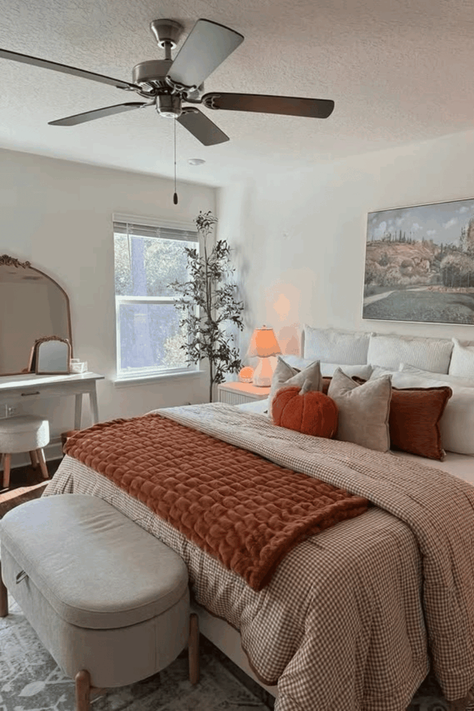 Chunky knit blanket and plaid throw at foot of the bed