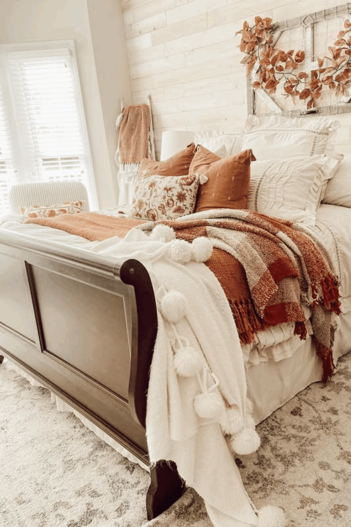 Layered throw pillows in different textures and earthy tones