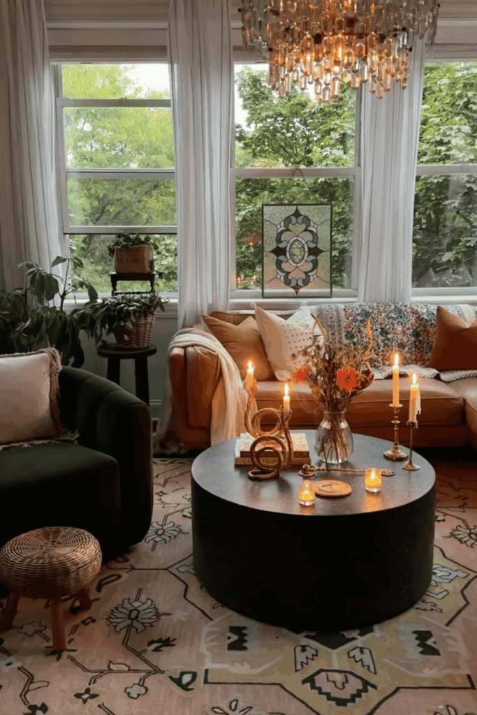 Romantic fall vignette with candlesticks, cozy throws, and soft lighting