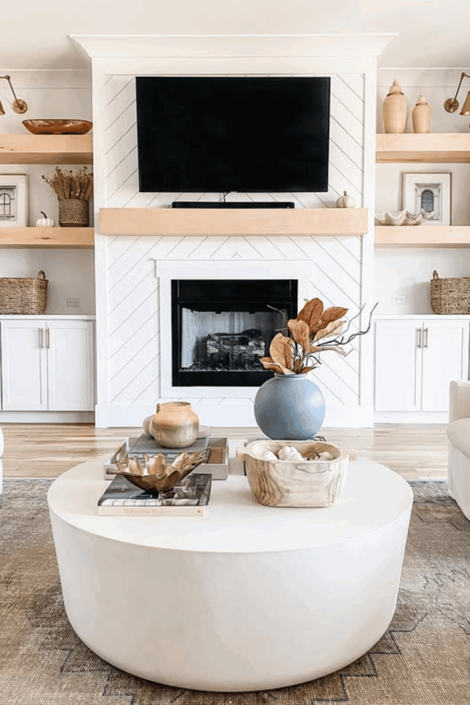 Dough bowl centerpiece with faux leaves, pine cones, and natural accents