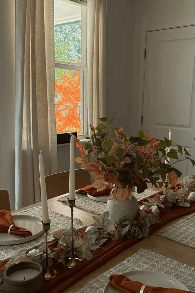Fall table runner with autumn leaves and skinny brass candles
