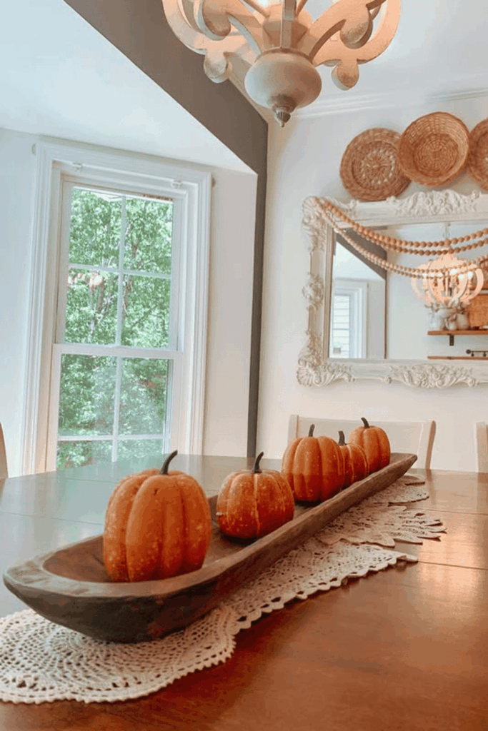 Dough bowl centerpiece with mini pumpkins for a classic fall table