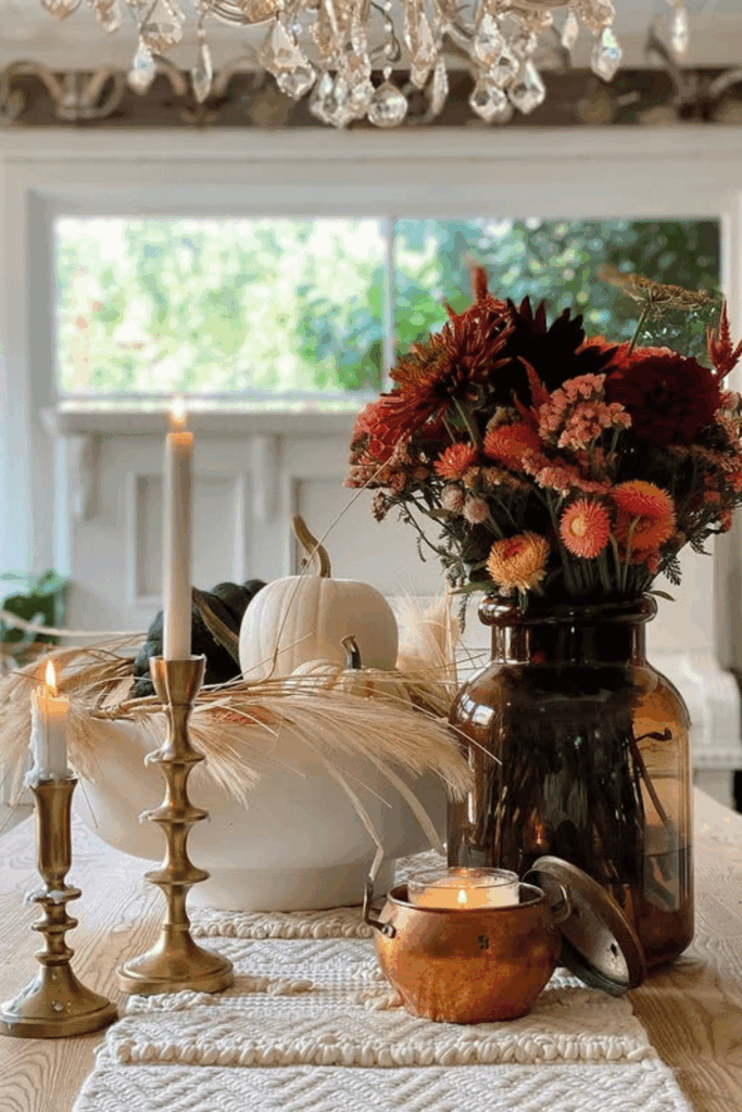 Brass candlesticks with pumpkins for a warm fall tablescape