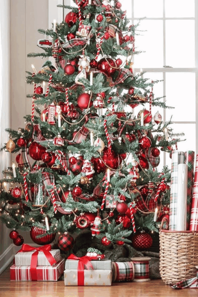 Red Christmas tree with plaid ribbon, candy canes, and wrapped gifts