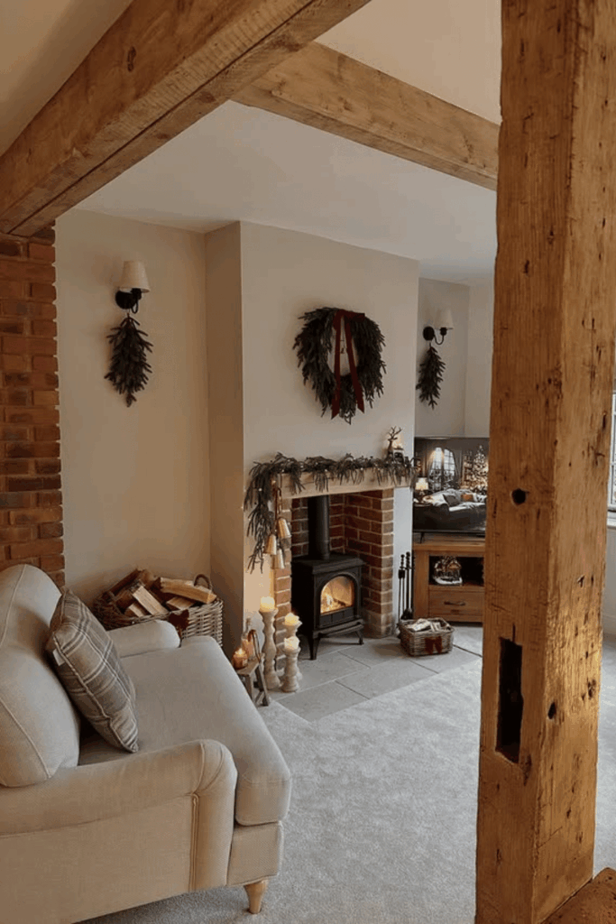 Neutral living room with subtle greenery accents and simple wreaths