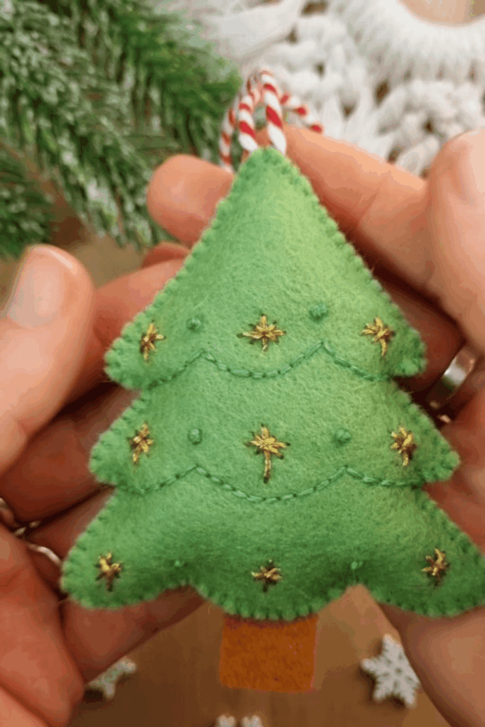 Green felt Christmas tree ornament with gold embroidered stars