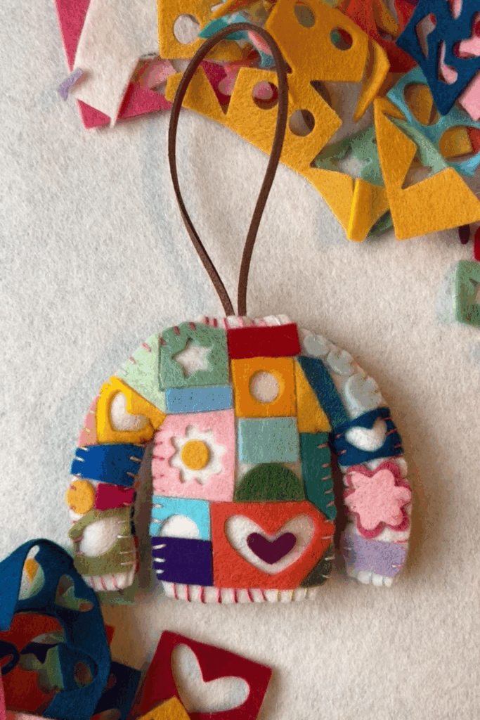 Colorful patchwork felt sweater ornament made from small felt scraps