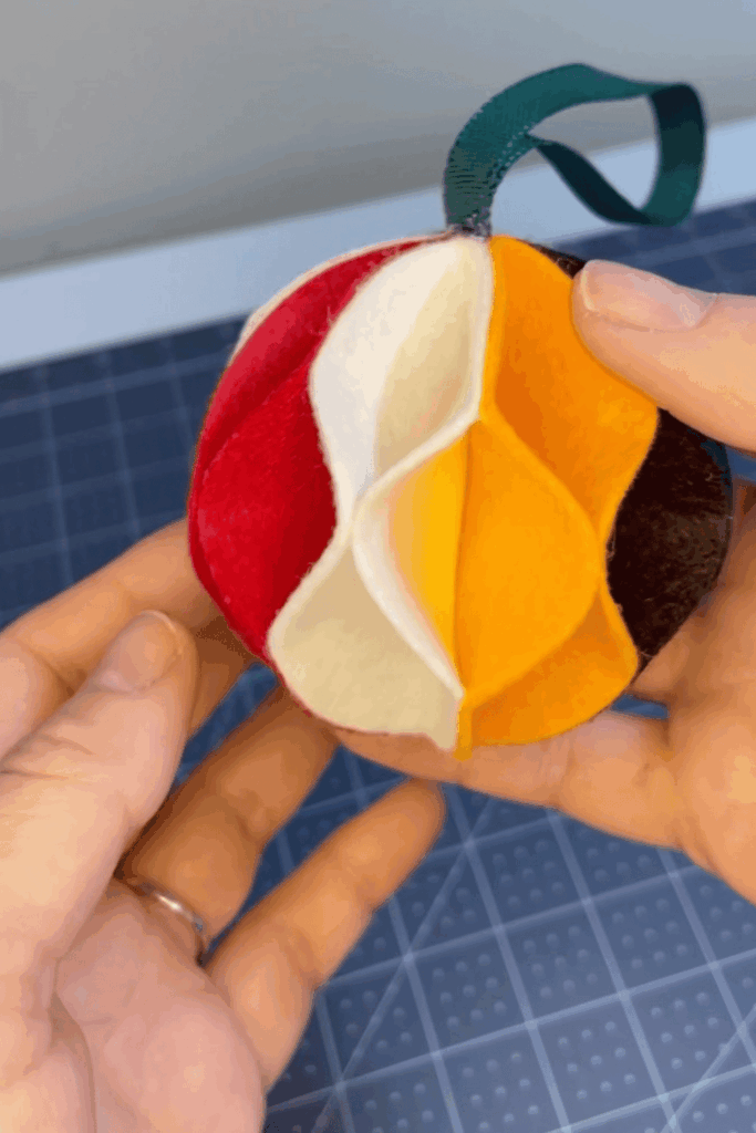 Colorful 3D layered felt bauble ornament with multiple curved segments