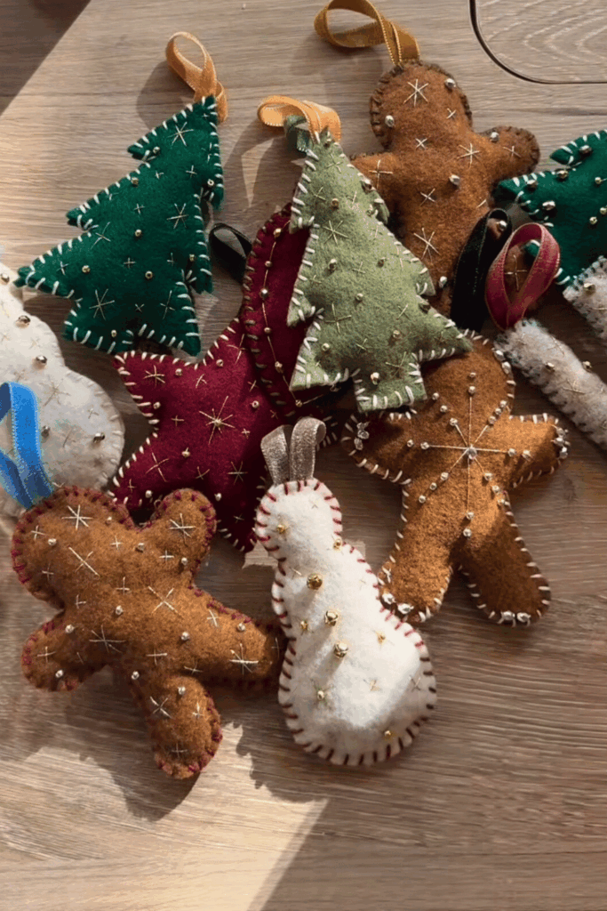 Assorted felt Christmas ornaments with bead and starburst stitching