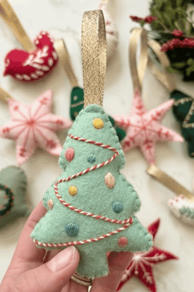 Mint green felt Christmas tree ornament with colorful embroidered baubles