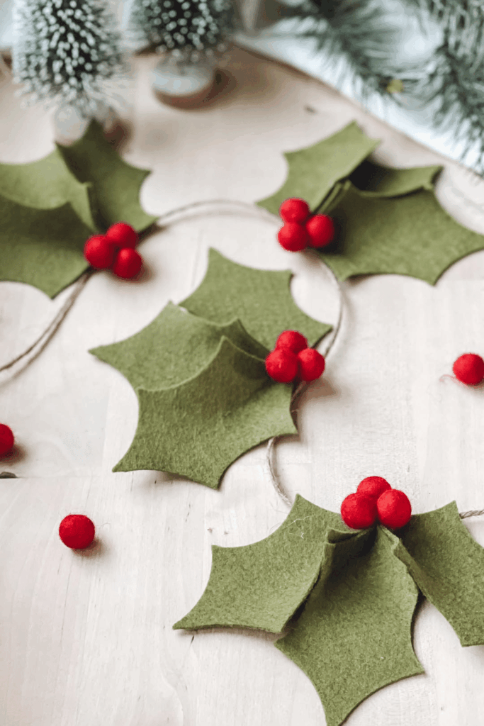 Green felt holly garland with red pom-pom berries