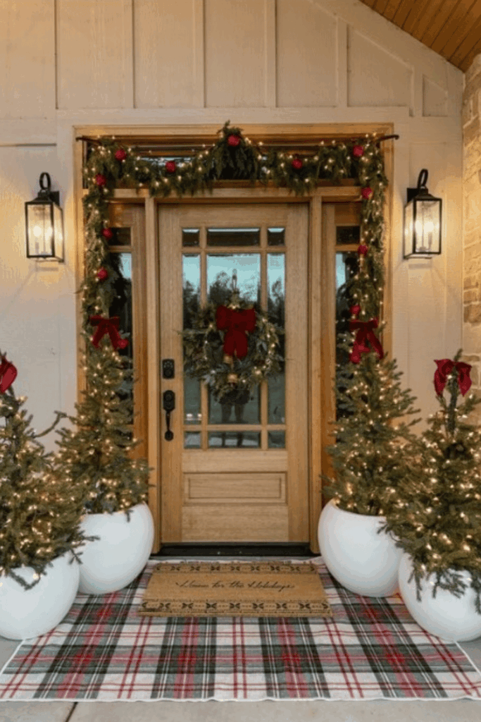 Cozy plaid porch decor with mini trees and Christmas lights