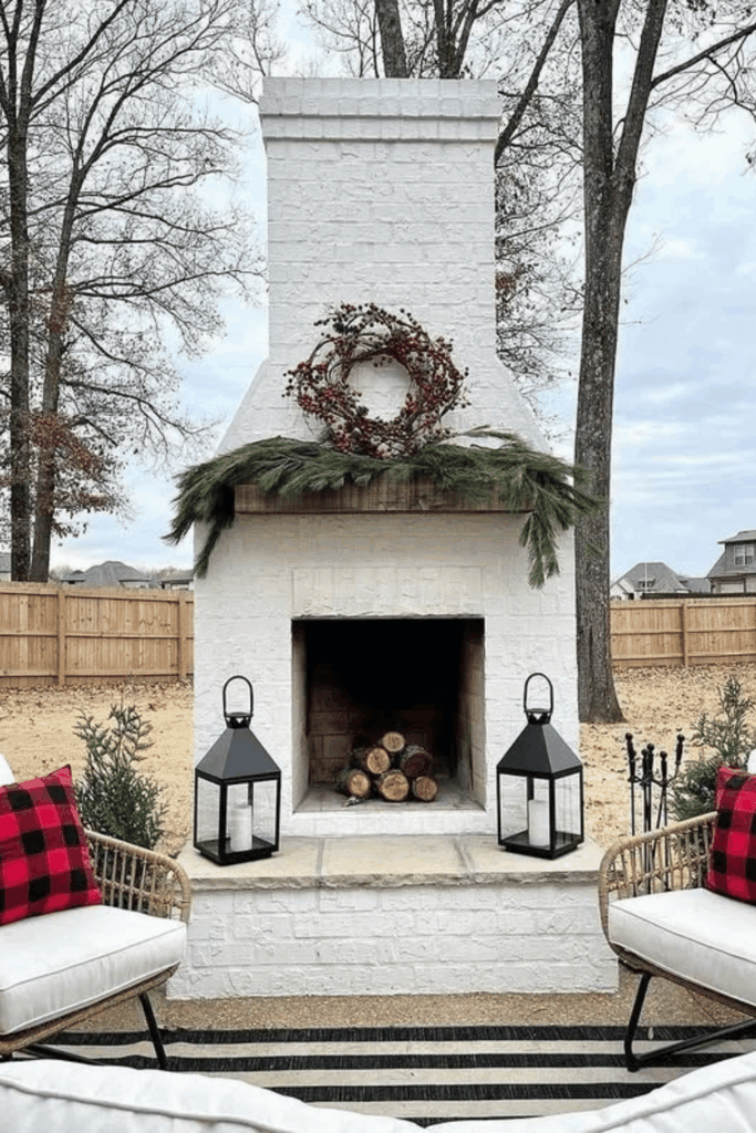 Minimal outdoor fireplace with wreath and simple greenery
