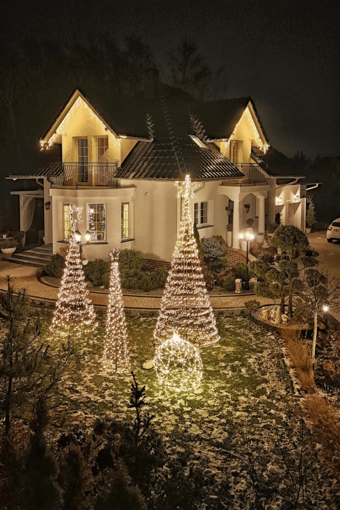 Christmas garden with cascading string lights and lit trees