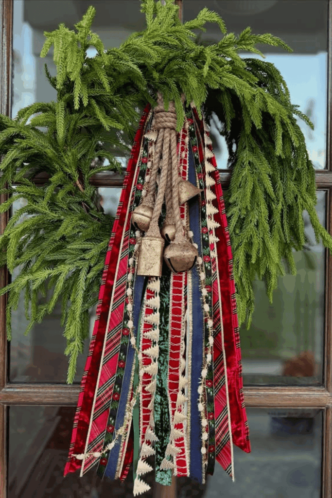 Boho Christmas wreath with colorful ribbons and vintage bells