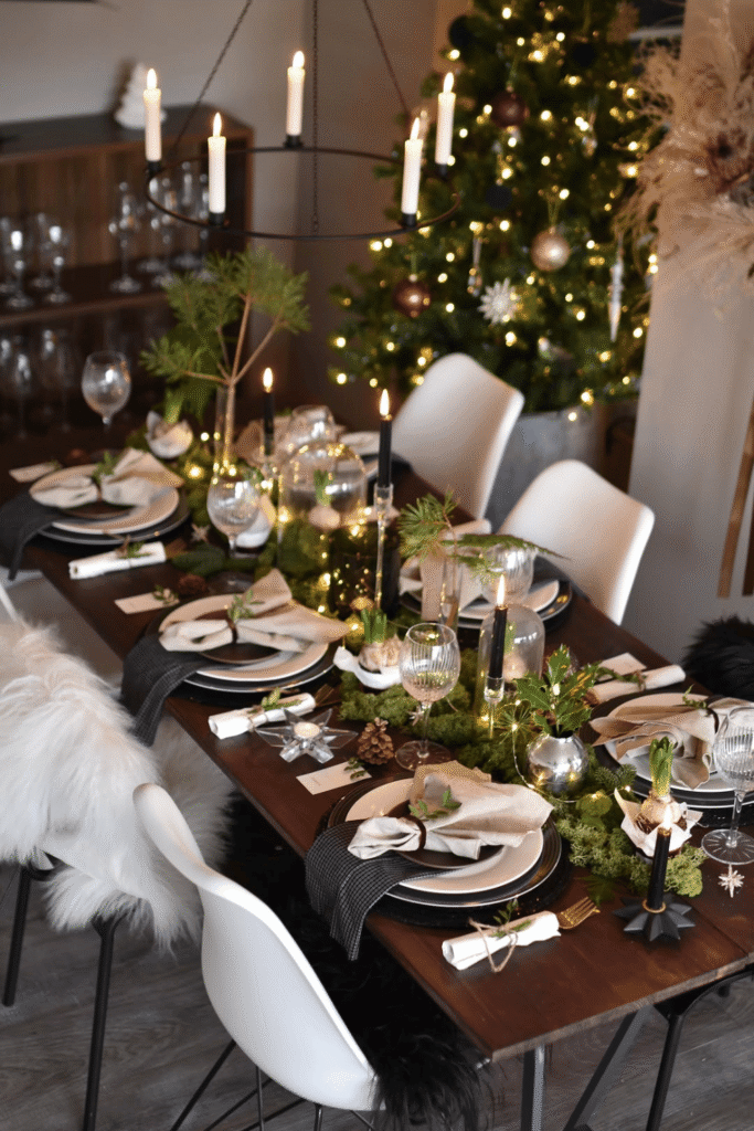 Cozy Christmas dining table with natural textures and greenery accents
