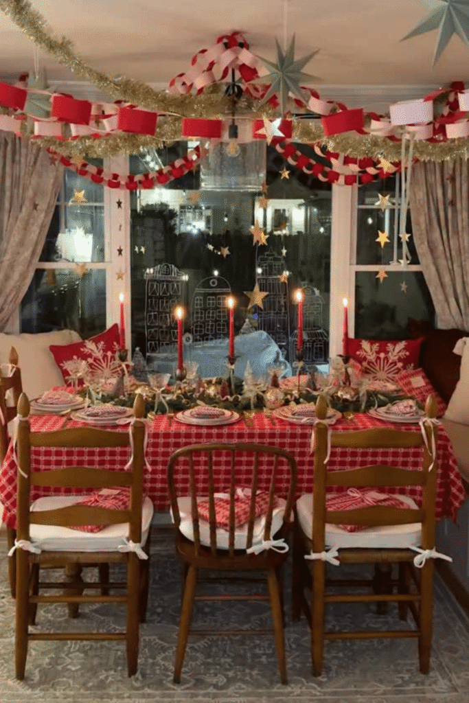 Playful Christmas table setting with paper chains and patterned linens