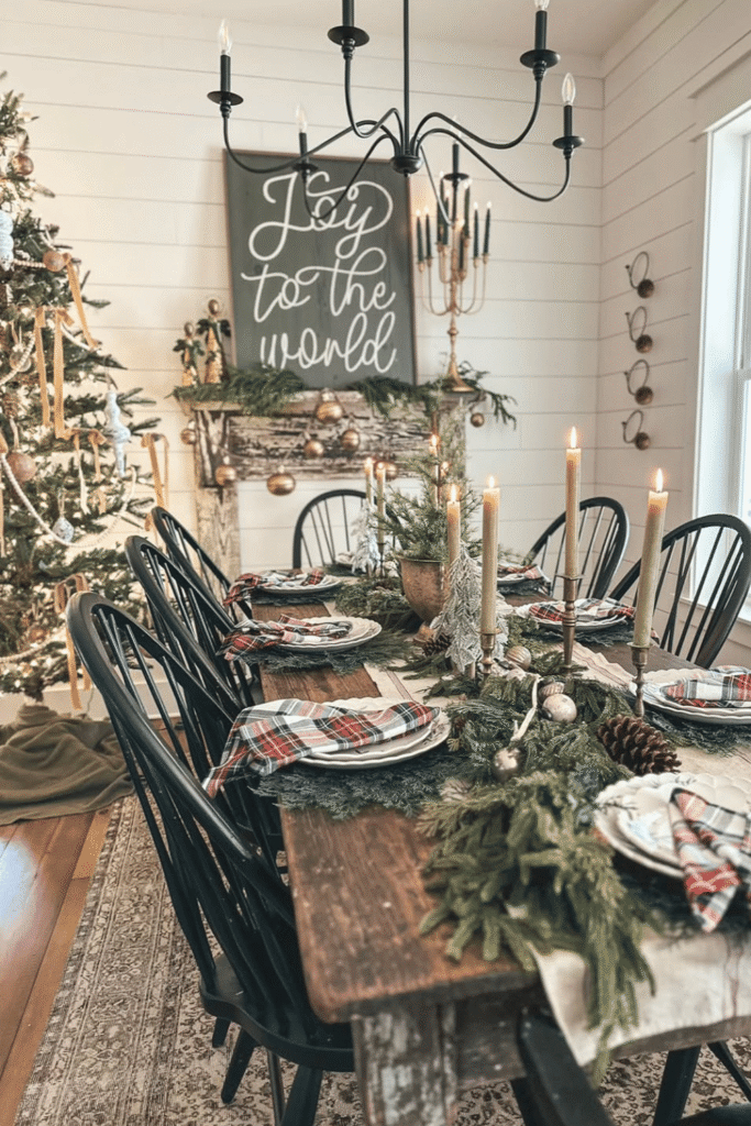 Farmhouse-style Christmas table centerpiece with greenery and candles