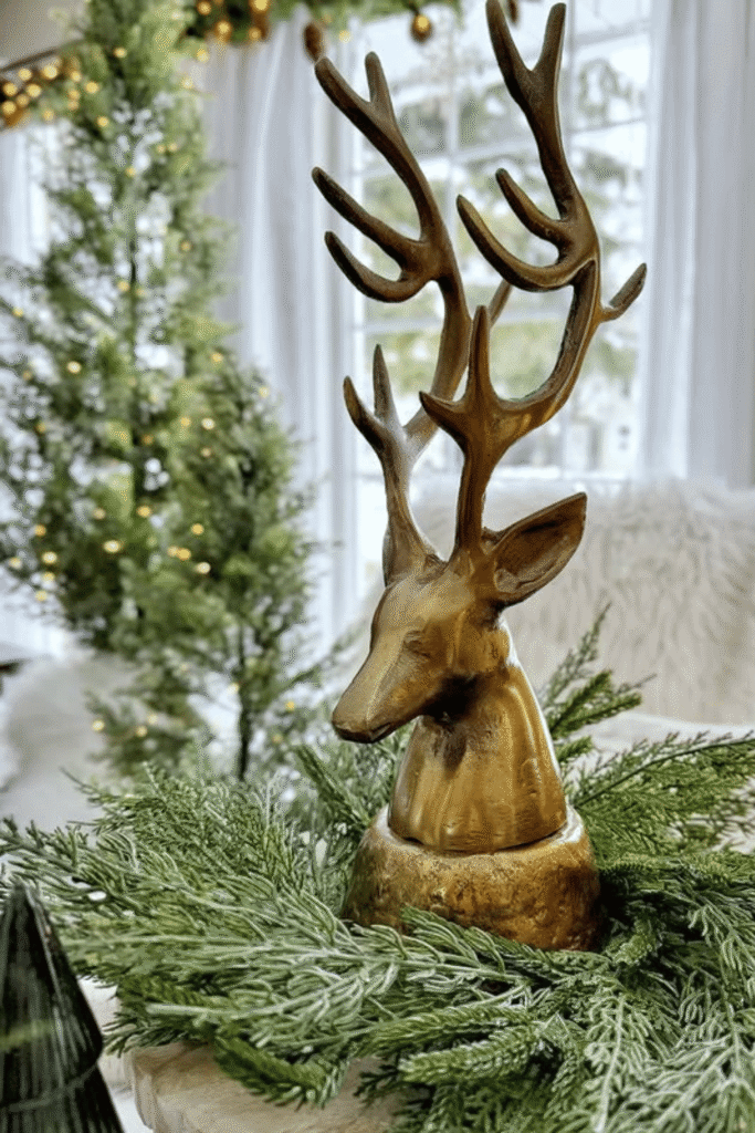 Holiday table centerpiece with decorative accent and greenery base
