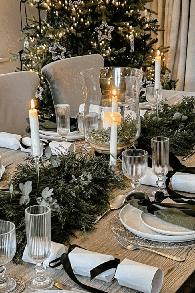 Simple greenery and votive candle centerpiece for Christmas table decoration