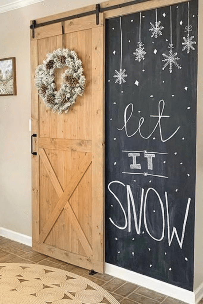 Large let it snow chalkboard wall with bold winter hand lettering