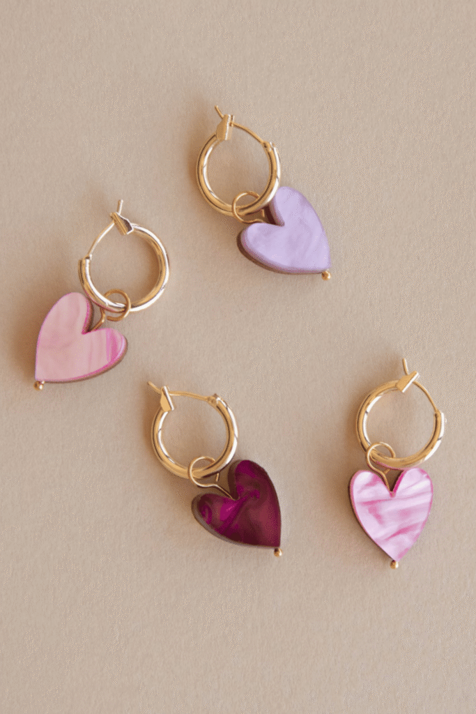 Heart-shaped clay earrings in soft pink and purple tones