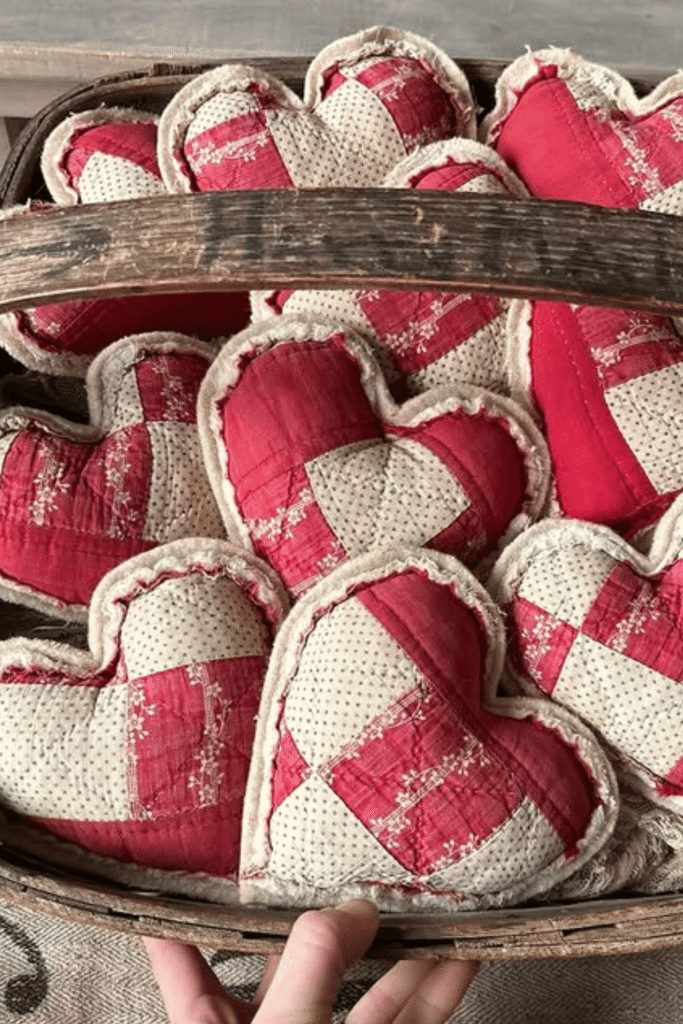 Patchwork fabric heart pillows in red and cream tones