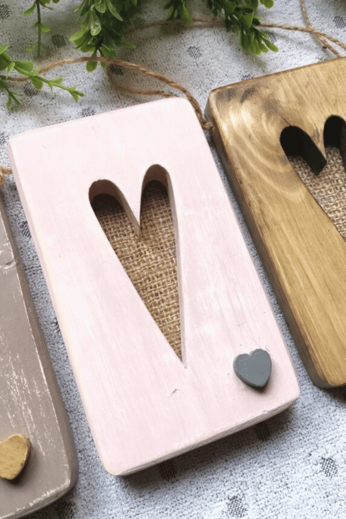 Painted wooden heart plaques with cut-out design