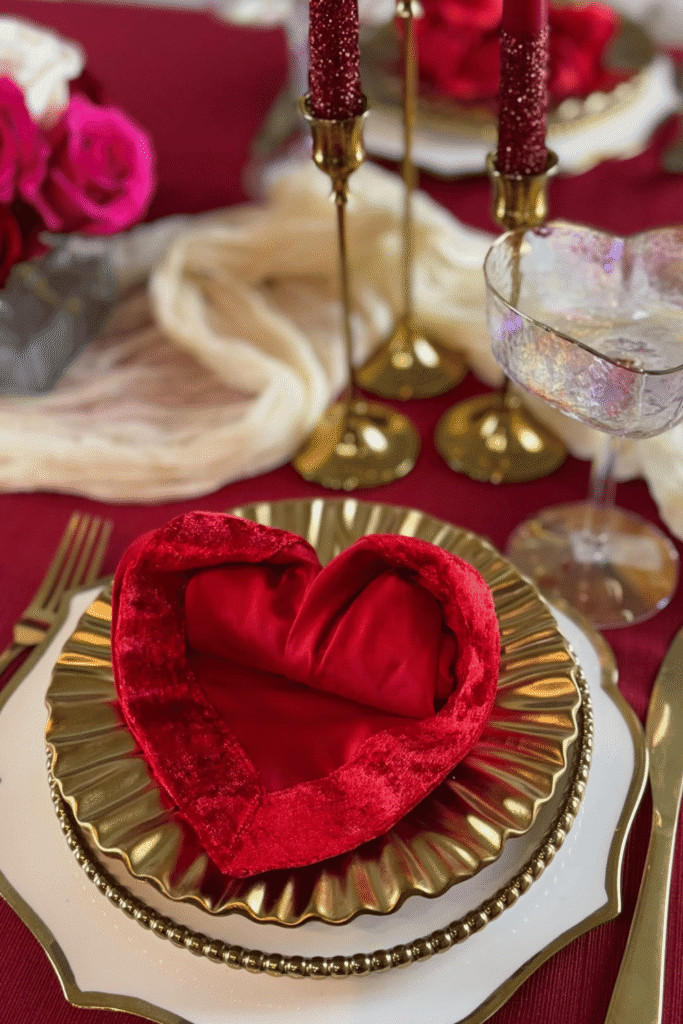 Elegant Valentine’s table setting with velvet heart napkin and gold accents