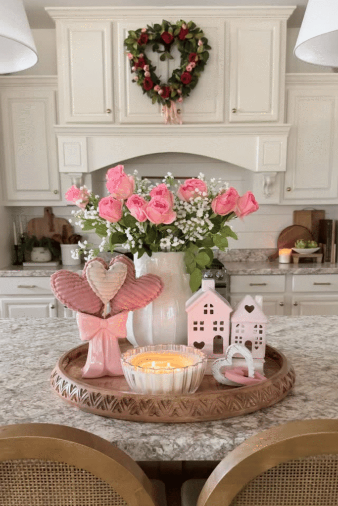 Valentine’s kitchen island tray with pink flowers, candles, and heart decor