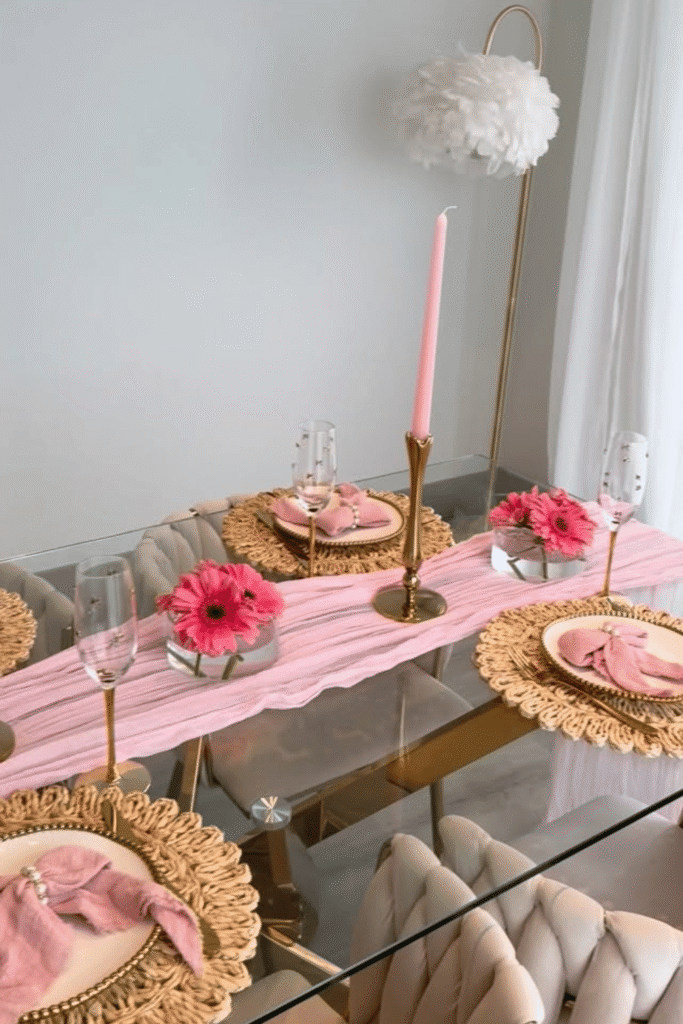 Modern Valentine’s table with pink runner, woven placemats, and soft floral decor